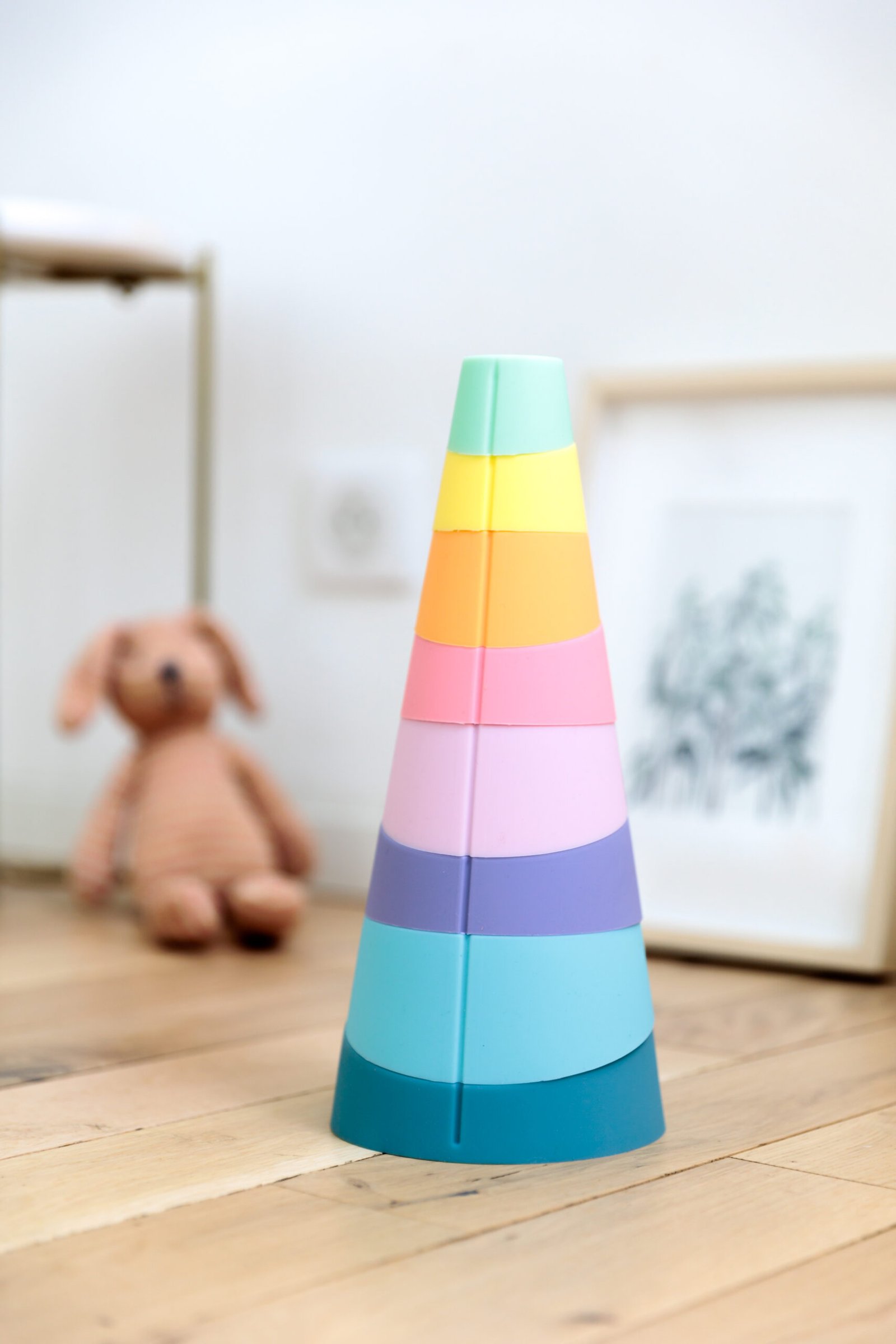 STAK silicone stacking pieces arranged in a colorful tower