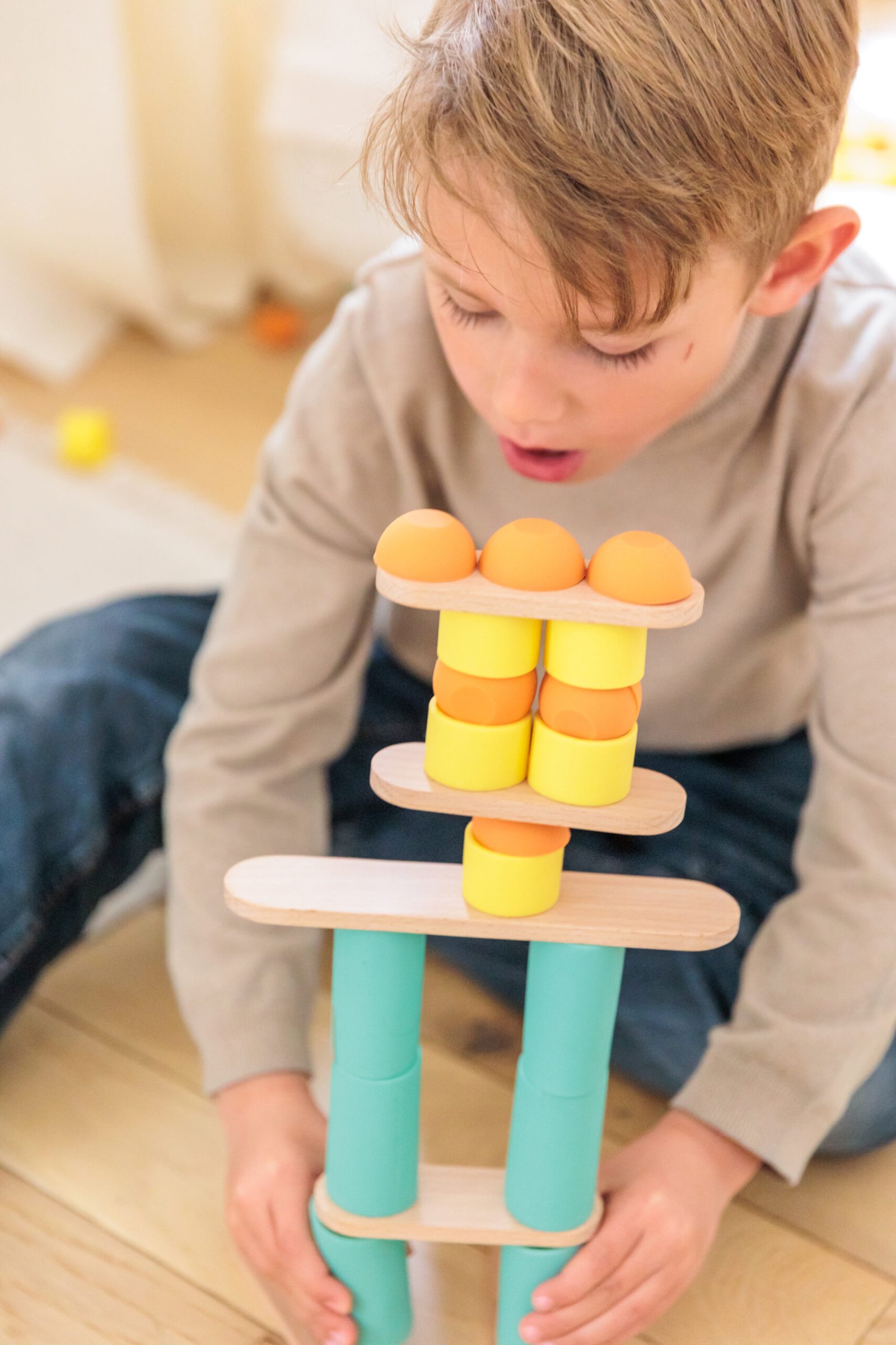 wooden planks and silicone connectors forming a tall bridge